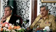  ?? AFP ?? Military spokesman Major-General Babar Iftikhar speaks next to Foreign Minister Shah Mahmood Qureshi during a Press conference in Islamabad on Saturday. —