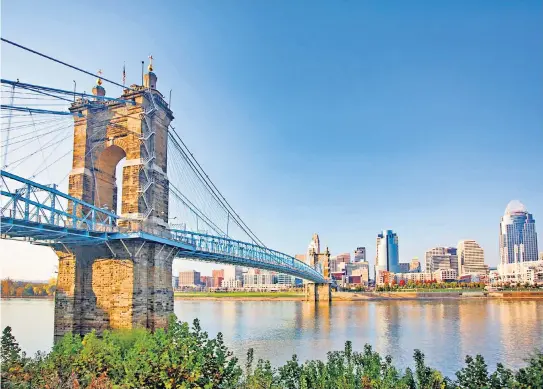  ?? ?? Take me to the river: the John A Roebling Bridge spans the Ohio, linking Kentucky to the south with Cincinnati to the north