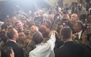  ?? Saul Loeb / AFP / Getty Images ?? President Obama mingles with soldiers at Fort Lee, Va., after praising them for setting a good example.
