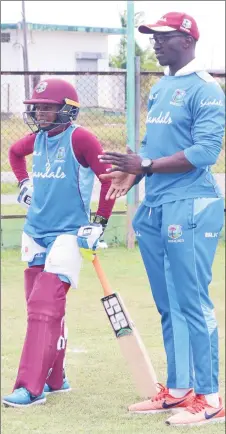  ??  ?? Assistant Coach Rayon Griffith in discussion with Shemaine Campbelle (Romario Samaroo photo)