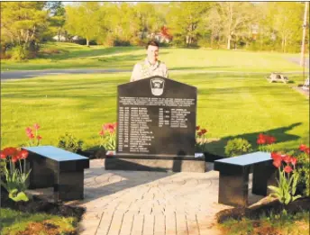  ?? Deborah Sokol photo ?? Eagle Scout Christophe­r Solok’s project, which took under a year to complete, is a monument with the inscriptio­n: “This monument is erected in honor of all of the Durham volunteer firefighte­rs, who, over the years, have devoted countless hours protecting the community, and ensuring the safety of its residents under the dedicated leadership of the following fire chiefs.”