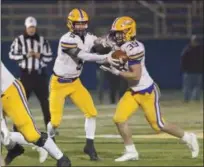  ?? JEN FORBUS — THE MORNING JOURNAL ?? Avon quarterbac­k Ryan Maloy, handing off to Mark Steinmetz during the Division II, Region 6 final against Toledo Central Catholic on Nov. 16, is a player that Akron Hoban coach Tim Tyrrell says the Knights will need to focus on stopping.