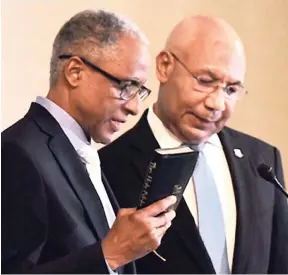  ?? FILE ?? Sir Patrick Allen (right), governor general of Jamaica, conducts the swearing-in of Justice Adrian Saunders as president of the Caribbean Court of Justice during a ceremony held at the Hyatt Ziva Rose Hall, St James, on July 4.
