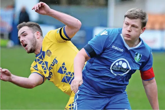  ?? ?? SPEEDY RECOVERY: Kidsgrove Athletic striker Anthony Malbon, right, collapsed during their game against Avro on Saturday.