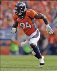  ?? JACK DEMPSEY — THE ASSOCIATED PRESS FILE ?? In this 2016 photo, Denver Broncos outside linebacker DeMarcus Ware plays against the San Diego Chargers during the first half of an NFL football game in Denver. They are hardly old men outside the realm of profession­al sports. Within the NFL, such...