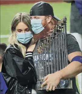  ?? Robert Gauthier Los Angeles Times ?? JUSTIN TURNER, shown with wife Kourtney, apologized for coming on the field to celebrate the World Series title after being pulled because of the coronaviru­s.