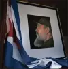 ?? Picture: AP ?? An image of Fidel Castro and a Cuban flag are displayed in honour of the late leader.