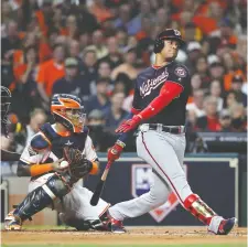  ?? ELSA/GETTY IMAGES ?? Juan Soto of the Nationals strikes out against the Houston Astros during the first inning in Game 1 of the 2019 World Series at Minute Maid Park on Tuesday in Houston.