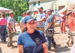  ?? PHOTO SUBMITTED BY FIRST LADY'S OFFICE, TAKEN BY T.J. LAMBUI ?? First Lady Maria Lee speaks with volunteers May 14 at a building project with A Soldier's Journey Home.