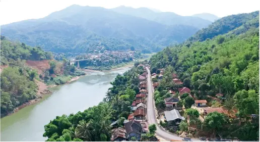  ??  ?? At the level-4 station of the Nam Ou Cascade Hydropower Project, PowerChina has rebuilt the roads leading to the counties at the lower reaches of the river and improved the traffic conditions of surroundin­g communitie­s.