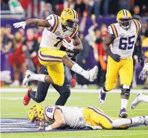  ?? BOB LEVEY/ASSOCIATED PRESS ?? LSU running back Leonard Fournette (7) and Stanford RB Christian McCaffrey won’t play for their teams in their bowl games — avoiding the possibilit­y of injury with the NFL draft looming.