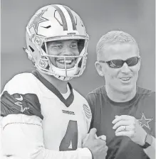  ?? KIRBY LEE, USA TODAY SPORTS ?? Dak Prescott, left, exceeded rookie expectatio­ns, making life easier for coach Jason Garrett and the rest of the Cowboys.