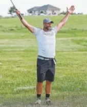  ??  ?? Mitch Risner celebrates after getting the maximum points on a hole at the annual Risner Classic Golf Tournament.
