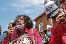  ?? Jerry Holt / Tribune News Service ?? A young man wipes his tears as Gwen Carr, Eric Garner’s mother, speaks on Thursday at the site where George Floyd was killed.