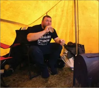  ?? PAUL DALY, THE CANADIAN PRESS ?? Richard Gillett in the tent that he set up outside of the Department of Fisheries and Oceans offices in St. John’s.