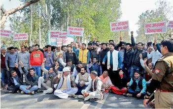  ??  ?? Members of Akhil Bharatiya Jat Arakshan Sangharsh Samiti protesting for their demand of reservatio­n in Moradabad on Monday.
— PTI