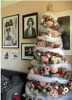  ??  ?? Michelle Matangi’s pink, red and white Christmas tree has bright pink donut decoration­s for a playful touch.
