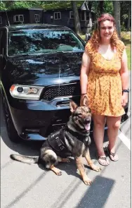  ??  ?? Brittany Murphy of West Haven with the police K-9 Magnus.