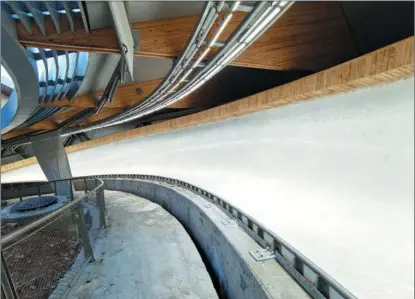  ?? SUN XIAOCHEN / CHINA DAILY ?? The ice track of the National Sliding Center will challenge the world’s best bobsled, skeleton and luge racers with sharp curves winding 1.9 kilometers down mountain ridges in Yanqing district during the 2022 Winter Olympics.