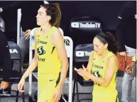  ?? Julio Aguilar / Getty Images ?? The Storm’s Breanna Stewart, left, and Sue Bird walk on to the court following a 104-91 win over Las Vegas Aces on Sunday in Game 2 of the WNBA Finals at Feld Entertainm­ent Center in Bradenton, Fla