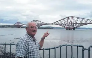  ??  ?? Charity champ John pictured at the Forth Bridge