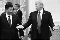  ??  ?? STRIKING A NEW TONE US President Donald Trump ( right) with Chinese President Xi Jinping. During his recent visit to Beijing, Trump praised China for taking advantage of another country for the benefit of its own citizens
