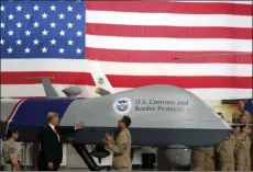  ?? PHOTO/ALEX BRANDON ?? President Donald Trump touches a drone during a tour of U.S. Customs and Border Protection Border equipment at their airport hanger at Marine Corps Air Station Yuma on Tuesday in Yuma, Ariz. AP