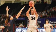  ?? DAVID JABLONSKI
/ STAFF ?? Dayton’s Tenin Magassa shoots against Duquesne on Sunday atUDArena. Twelve UD players saw action and 11 scored in the Flyers’ 64-48win.