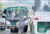  ??  ?? A man sanitising a Himachal Road Transport Corporatio­n bus in Mandi. BIRBAL SHARMA/HT