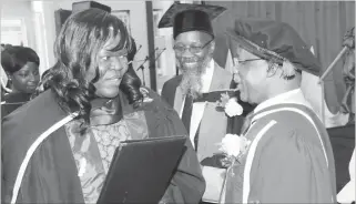  ??  ?? Ministry of Higher and Tertiary Education Permanent Secretary Professor Francis Gudyanga presents an ECD Diploma to Agnes Hadzizi while Bulawayo Polytechni­c Principal, Engineer Gilbert Mabasa looks on during a graduation ceremony on Friday