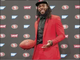  ??  ?? San Francisco 49ers new cornerback Richard Sherman poses for a photo after answering questions during an NFL football news conference in Santa Clara, on Tuesday. Sherman agreed to a three-year deal with the 49ers. AP PHOTO/TONY AVELAR