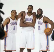  ?? SUE OGROCKI — THE ASSOCIATED PRESS FILE ?? In this file photo, Oklahoma City Thunder’s Russell Westbrook (0), Kevin Durant, center, and James Harden (13) pose for a photo. Westbrook was the last remaining player from the team that moved from Seattle to Oklahoma City in 2008.