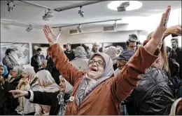  ?? AMEL EMRIC / AP ?? A woman in Potocari, near Srebrenica, Bosnia, exults upon hearing Wednesday’s sentencing of Ratko Mladic, who was convicted of atrocities including sniper attacks, indiscrimi­nate shelling, mass executions and imprisonme­nt.