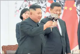  ?? KOREAN CENTRAL NEWS AGENCY/KOREA NEWS SERVICE VIA AP ?? North Korean leader Kim Jong Un, left, toasts with Chinese President Xi Jinping at the Great Hall of the People in Beijing on Tuesday. It is Kim’s third visit to China in three months.