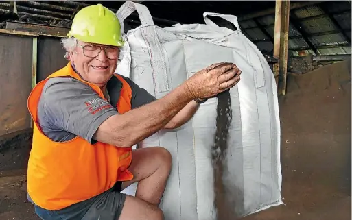  ?? JOHN HAWKINS/STUFF ?? Malcolm Sinclair checks a handful of humate (crushed lignite) at his business, Southern Humates, at Kapuka.