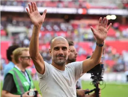  ?? AFP ?? Pep Guardiola celebrates after the Community Shield victory against Chelsea at Wembley Stadium on Sunday. —