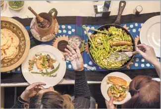  ?? Photograph­s by Ricardo DeAratanha Los Angeles Times ?? FOR THIS HOLIDAY spread, Guerrilla Taco founder and chef Wes Avila focuses on vegetables.