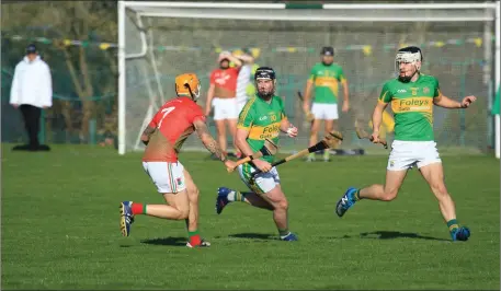  ??  ?? Raymond Galvin of Lixnaw under pressure from James Cummins of Cashel King Cormacs during theirMunst­er Club Intermedia­te championsh­ip game in Lixnaw