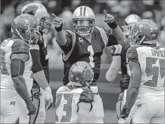  ?? BOB LEVERONE/AP PHOTO ?? Carolina Panthers quarterbac­k Cam Newton (1) signals his first down in a game on Dec. 24 against the Tampa Bay Buccaneers at Charlotte, N.C.