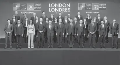  ?? REUTERS ?? NATO leaders and Secretary General Jens Stoltenber­g pose for the family picture at the NATO leaders summit in Watford, Britain on Wednesday.