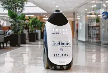  ?? Yi-Chin Lee / Staff photograph­er ?? Watson, a security robot, roams at the Walter Tower of Houston Methodist Hospital. The hospital has one other security robot, Holmes.