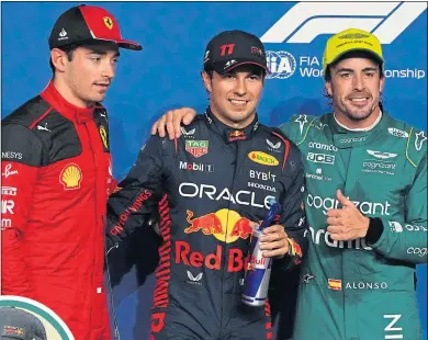  ?? ?? Sergio Perez (centre) celebrates pole position with Charles Leclerc (left) and Fernando Alonso following qualifying in Jeddah last night