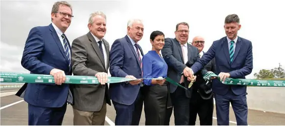  ?? Photos: Kevin Farmer ?? ON THE ROAD AGAIN: Cutting the ribbon of the Toowoomba Second Range Crossing are (from left) Member for Groom Dr John McVeigh, former Member for Groom Ian Macfarlane, Mayor Paul Antonio, Lockyer Mayor Tanya Milligan, Wright MP Scott Buchholz, Nexus chairman John Witheriff and Transport Minister Mark Bailey.