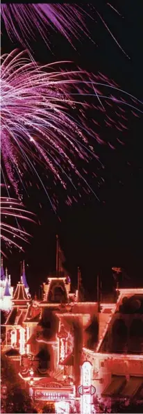  ?? ?? . Guests gather on Main Street, U.S.A., to watch the fireworks.