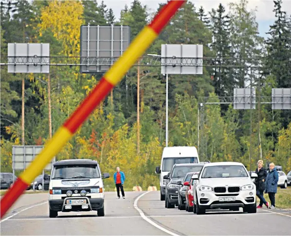  ?? ?? Cars wait at the border checkpoint between Russia and Finland, near Vaalimaa. The Nordic country has said it is preparing a national solution to ‘limit or completely prevent’ tourism from its neighbour, following the invasion of Ukraine