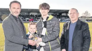  ??  ?? Winner St Mirren chairman Gordon Scott accepts the Family Champions award at the Buddies’ recent home clash with Brechin City