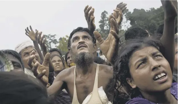  ?? PICTURE: AP ?? 0 Refugees fleeing the brutal crackdown by the army of Myanmar have found camps to be a mixed blessing as food begins to run out