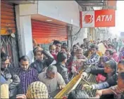  ?? HT/FILE ?? Rush of people before an ATM postdemone­tisation. Economists said the costs of demonetisa­tion—printing new currency notes and managing the increasing liquidity in the banking system—were among the main reasons for a fall in RBI’s profits