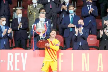  ?? HANDOUT/RFEF/AGENCE FRANCE-PRESSE ?? LIONEL Messi beams with pride after helping Barcelona win the Copa del Rey.