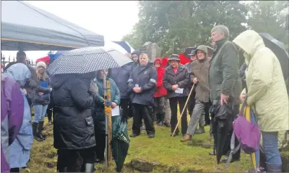  ??  ?? Around 50 people braved the inclement weather to attend the commemorat­ion service at Kilbride.